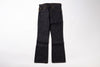 A pair of dark indigo denim jeans with a straight-to-flare leg, laid flat against a clean white background.