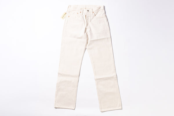 A pair of off-white or cream-colored denim jeans laid flat against a solid white background.
