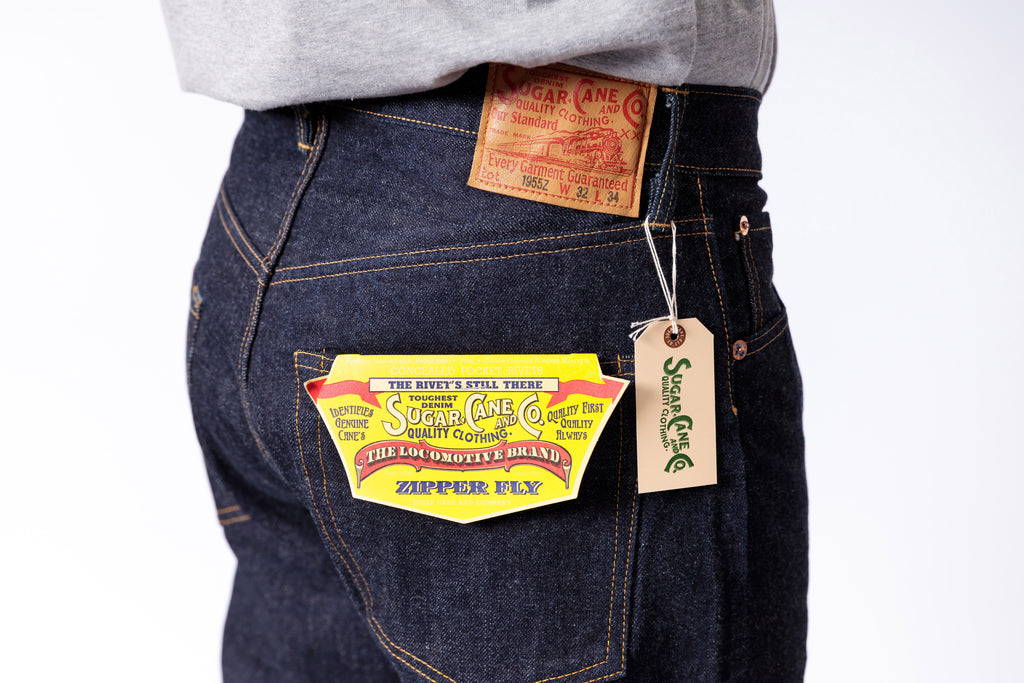 Close-up of Levi's jeans with brand labels and tags on a white background