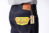 Close-up of Levi's jeans with brand labels and tags on a white background