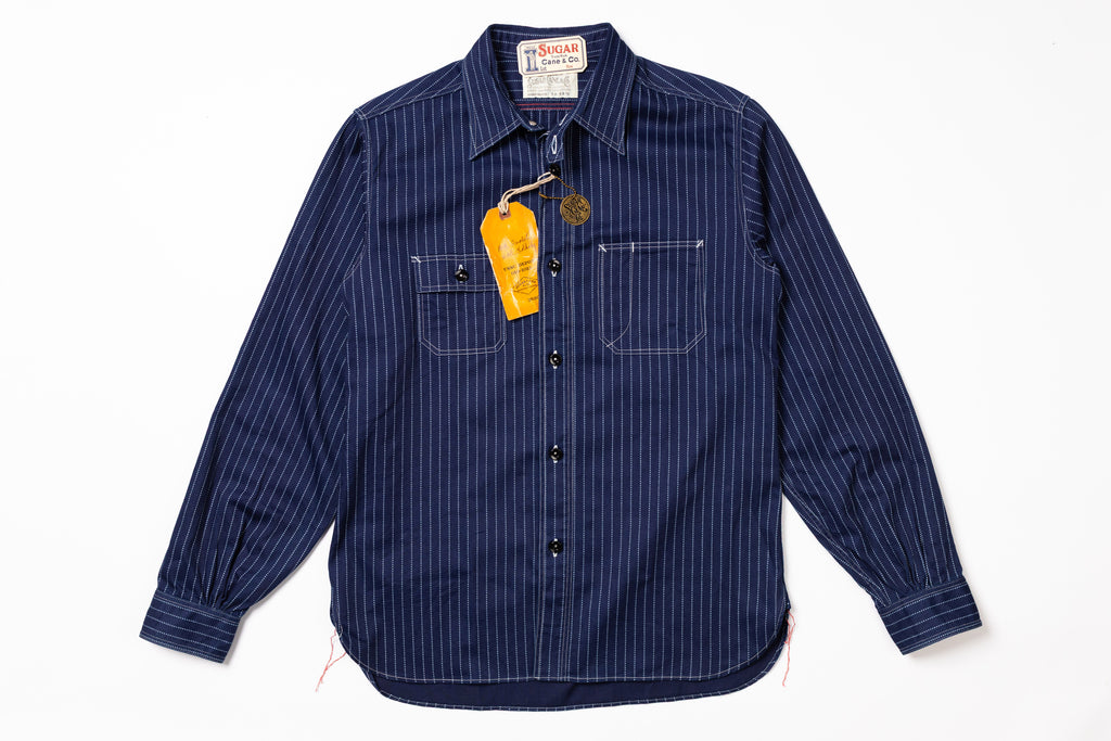 Blue striped shirt with a tag on a white background