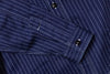 Close-up of a navy blue pinstripe shirt with button details