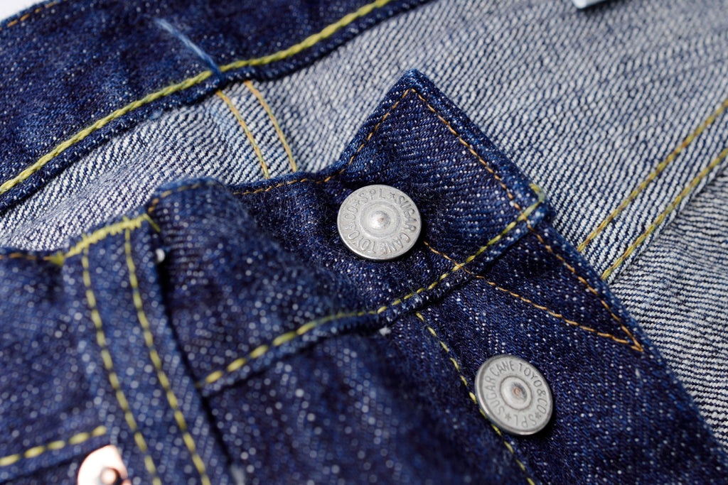 Close-up of a blue denim jacket with buttons