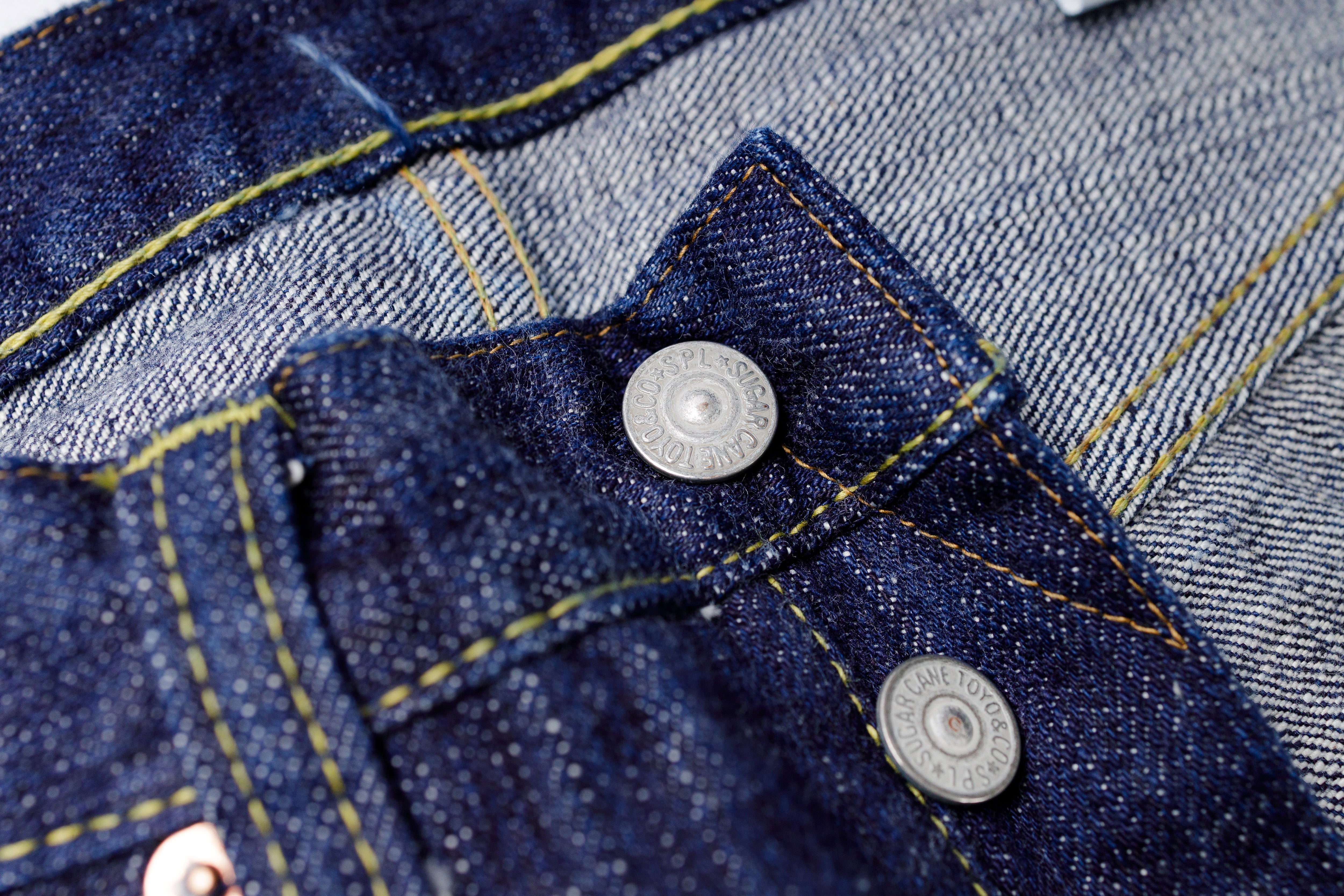 Close-up of a blue denim jacket with buttons