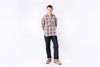 Person wearing a plaid shirt and jeans on a white background