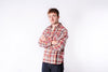 Man wearing a plaid shirt against a white background