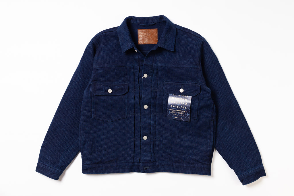 Navy blue jacket with a brand label on a white background