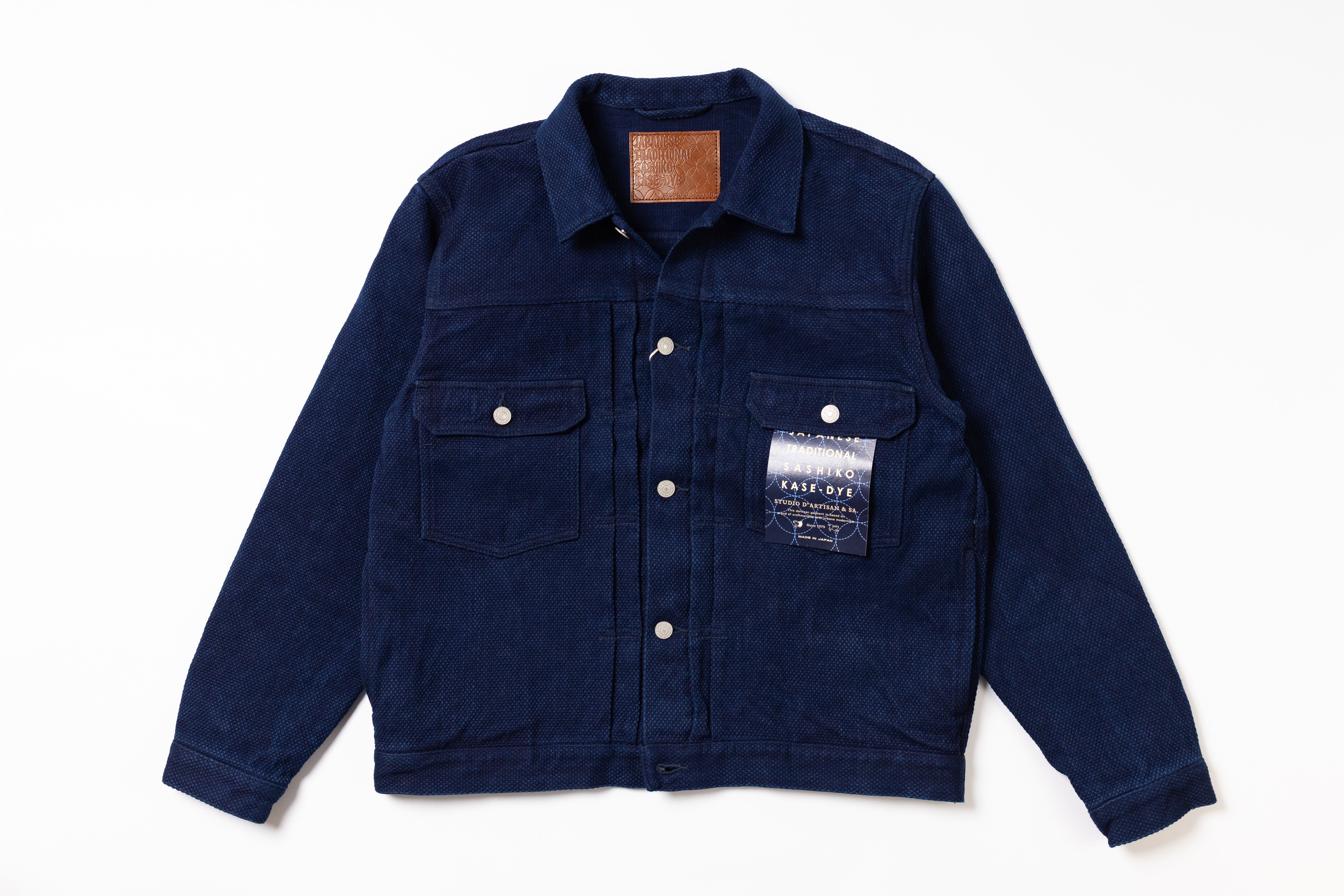 Navy blue jacket with a brand label on a white background