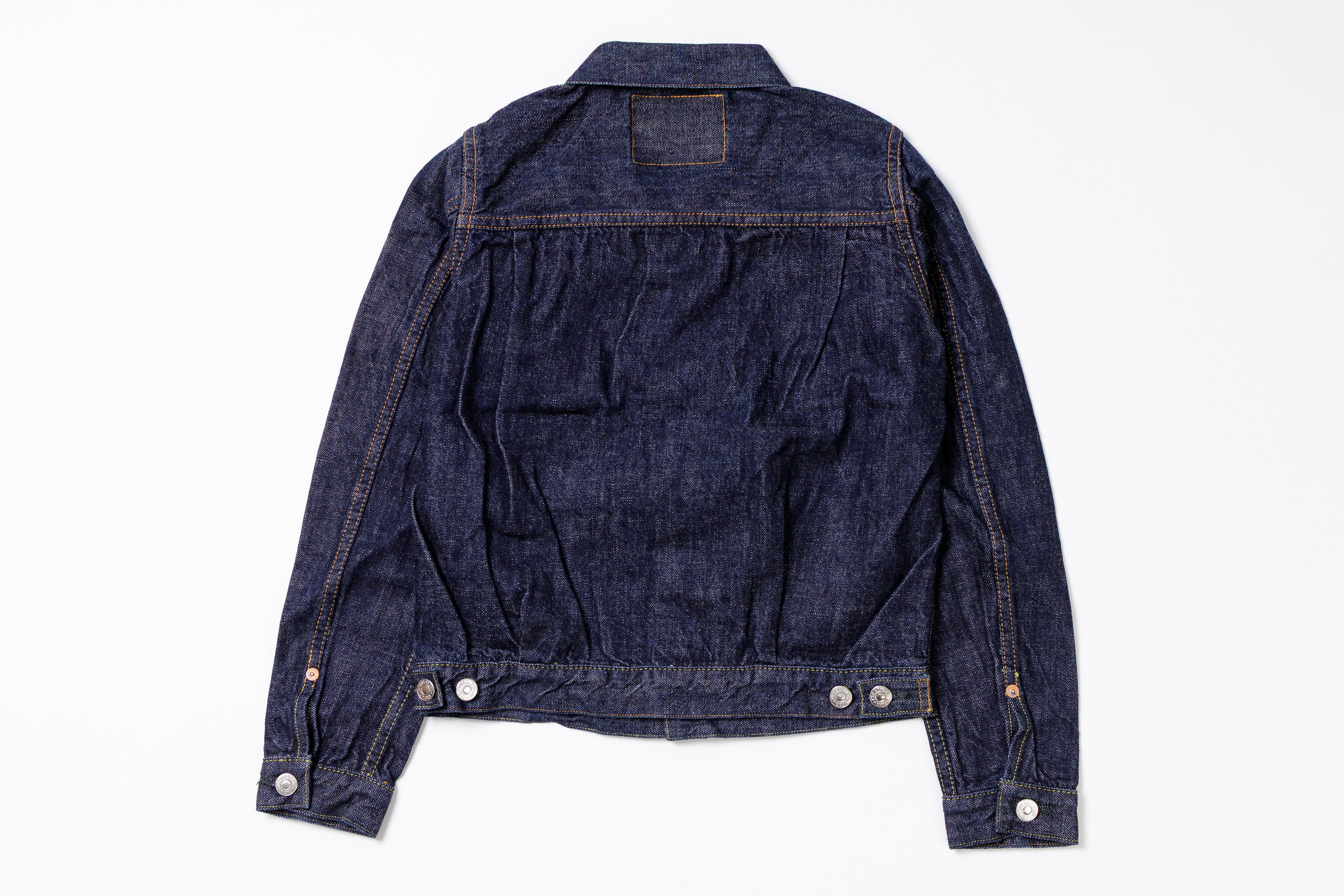 Blue denim jacket on a white background