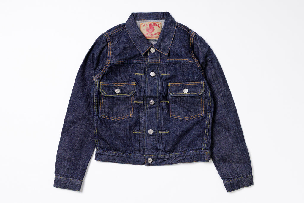 Blue denim jacket on a white background
