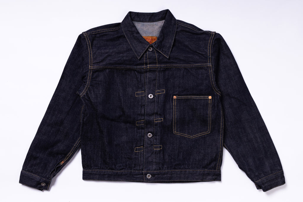 Dark denim jacket on a light gray background