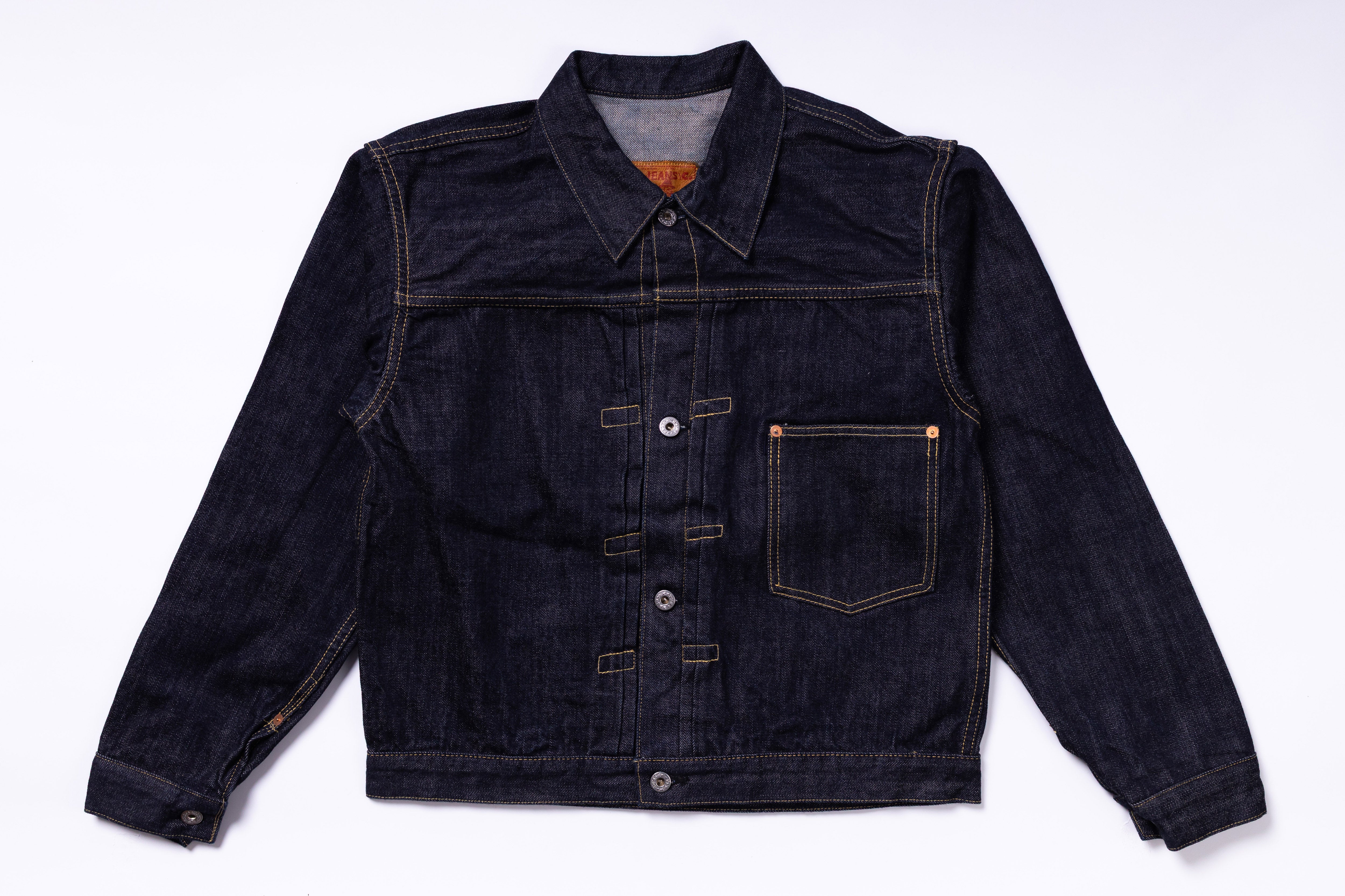 Dark denim jacket on a light gray background