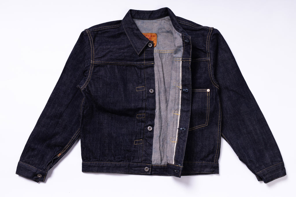 Dark denim jacket on a white background