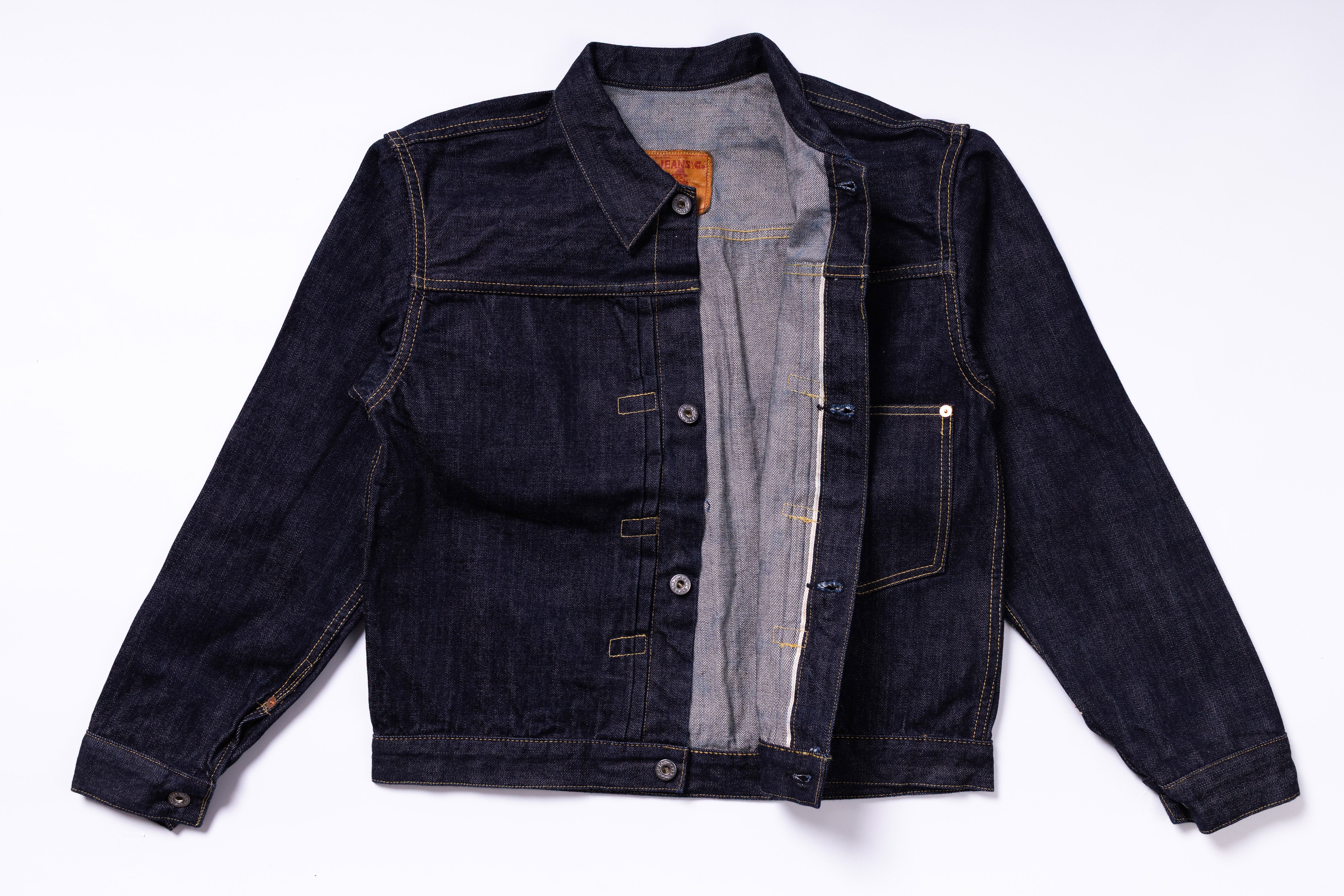 Dark denim jacket on a white background