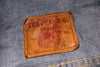 Levi's jeans label on a denim fabric background