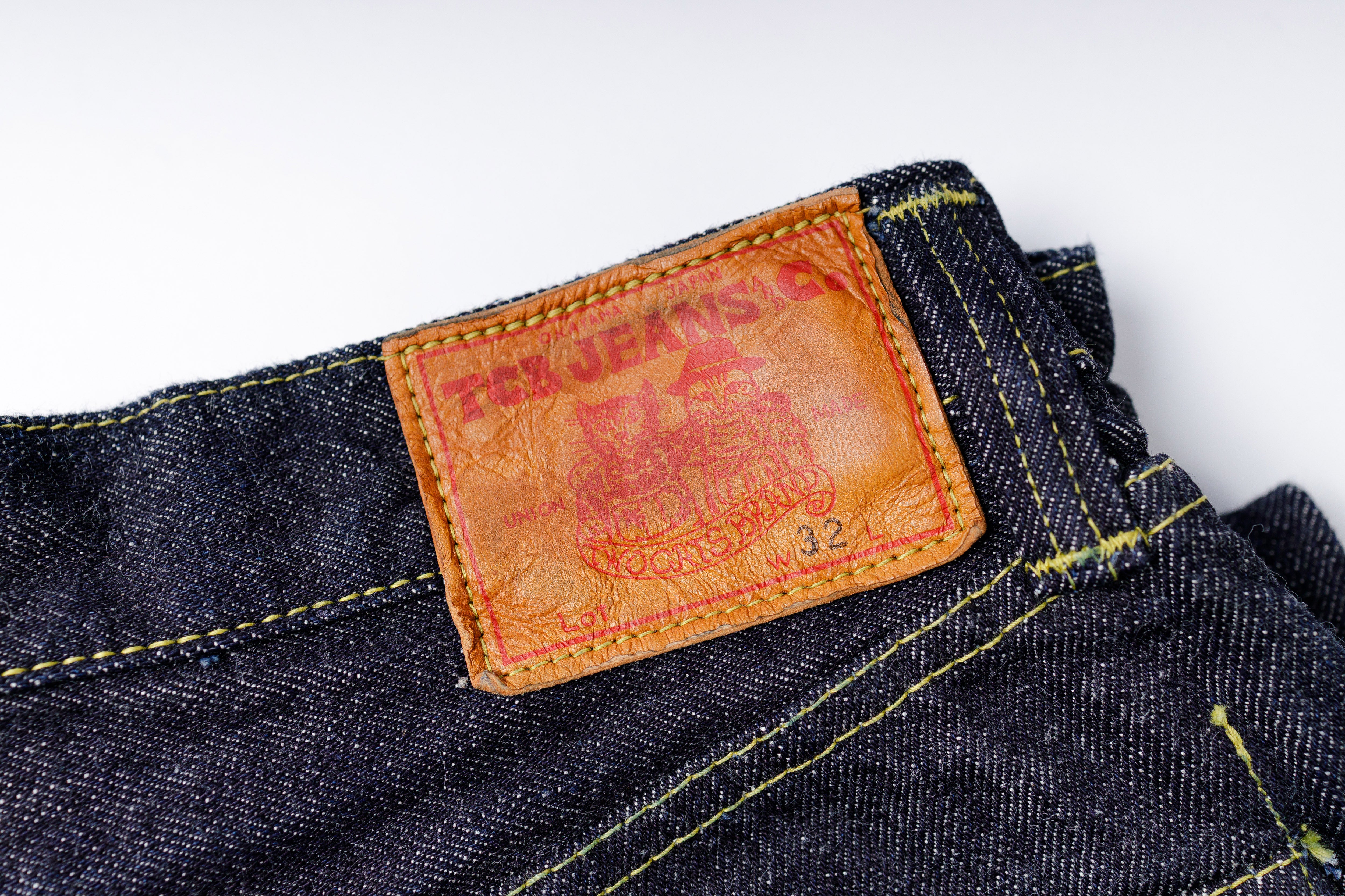 Close-up of a label on a pair of jeans with a white background