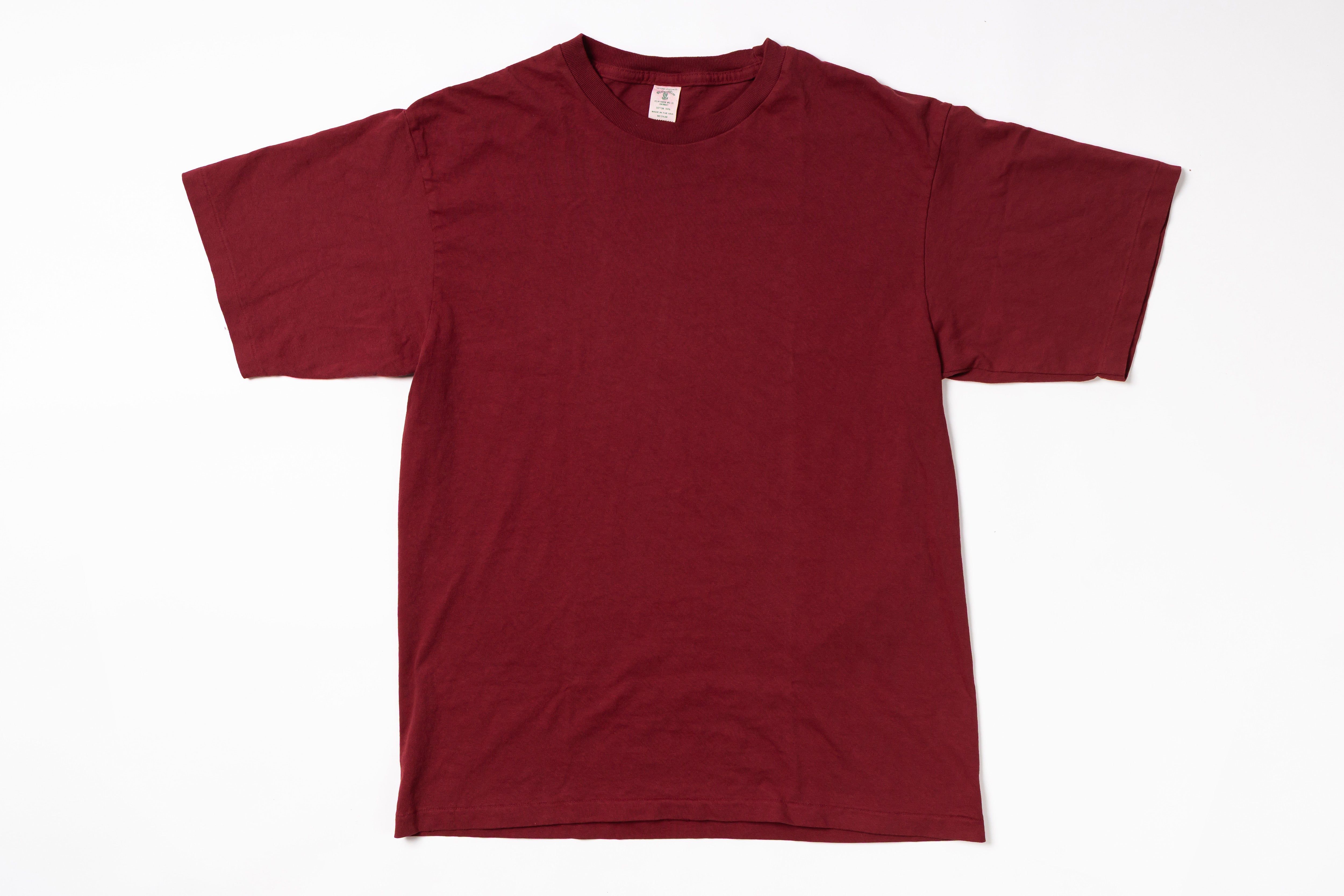 Maroon t-shirt on a white background