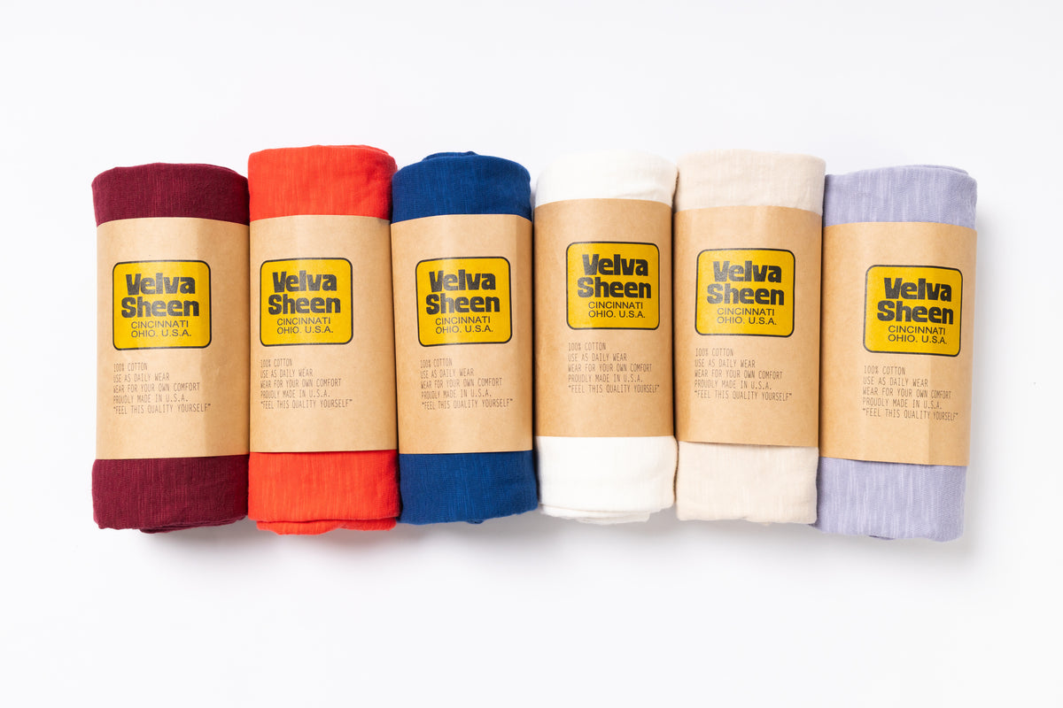 Set of Velva Sheen products in various colors on a white background