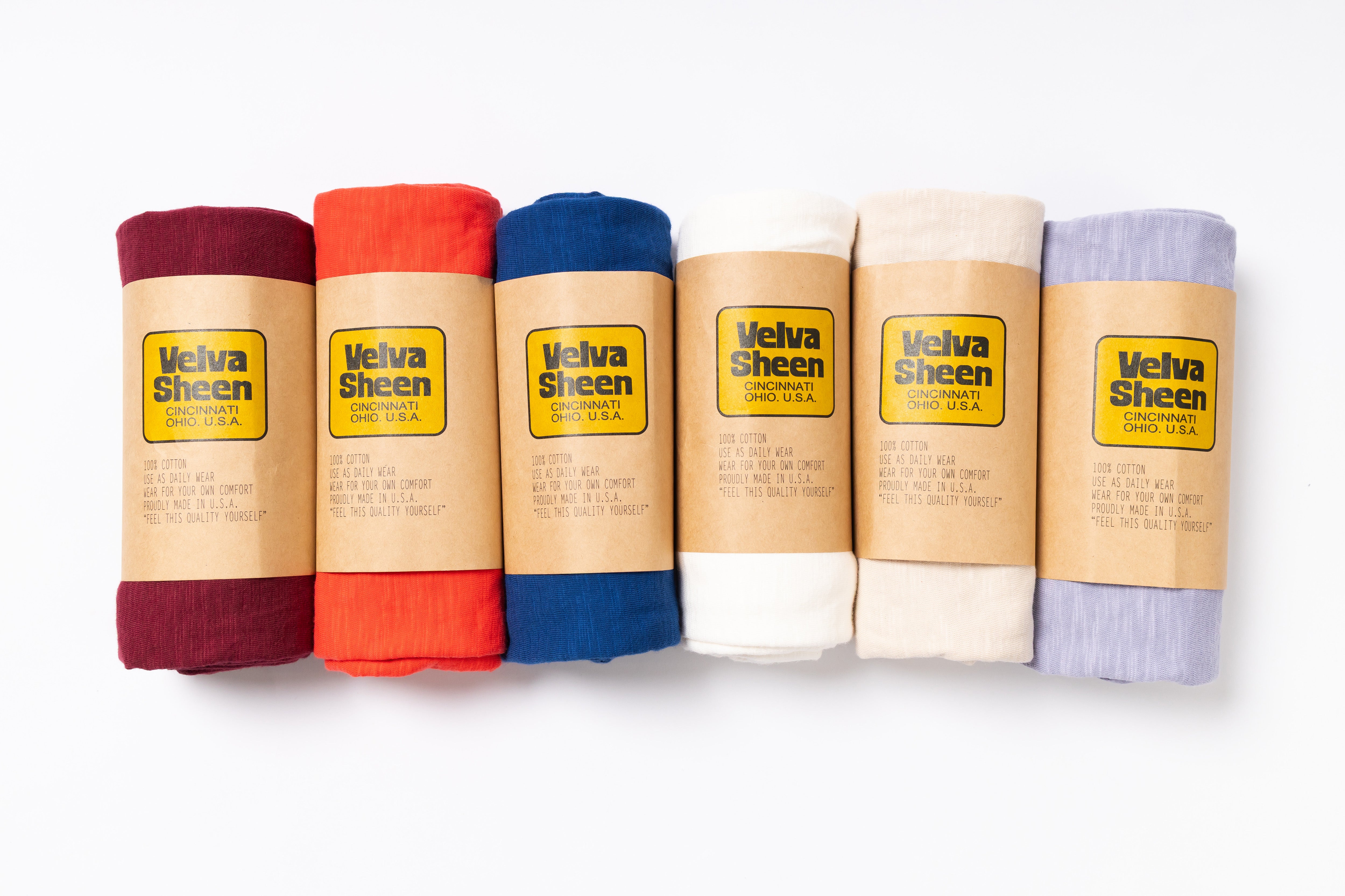 Set of Velva Sheen products in various colors on a white background