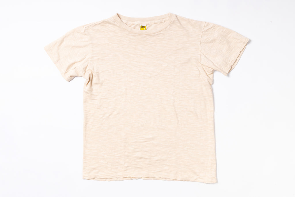 Beige t-shirt on a white background