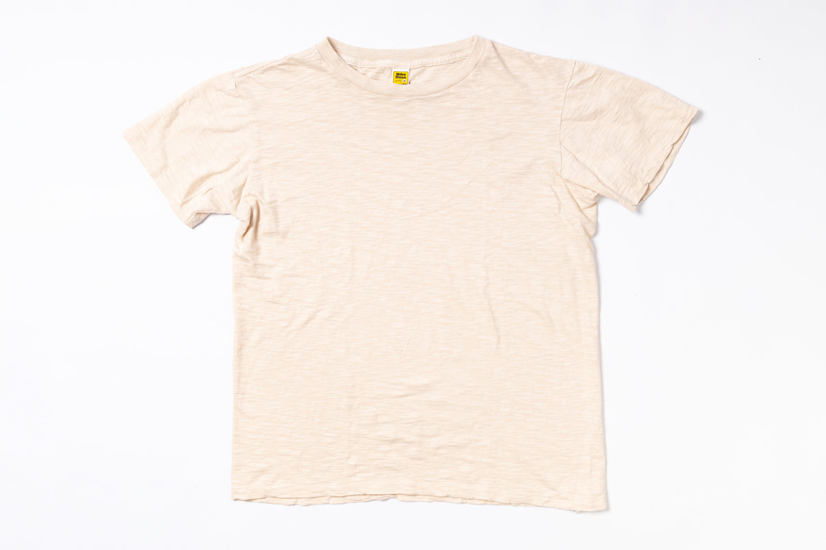 Beige t-shirt on a white background