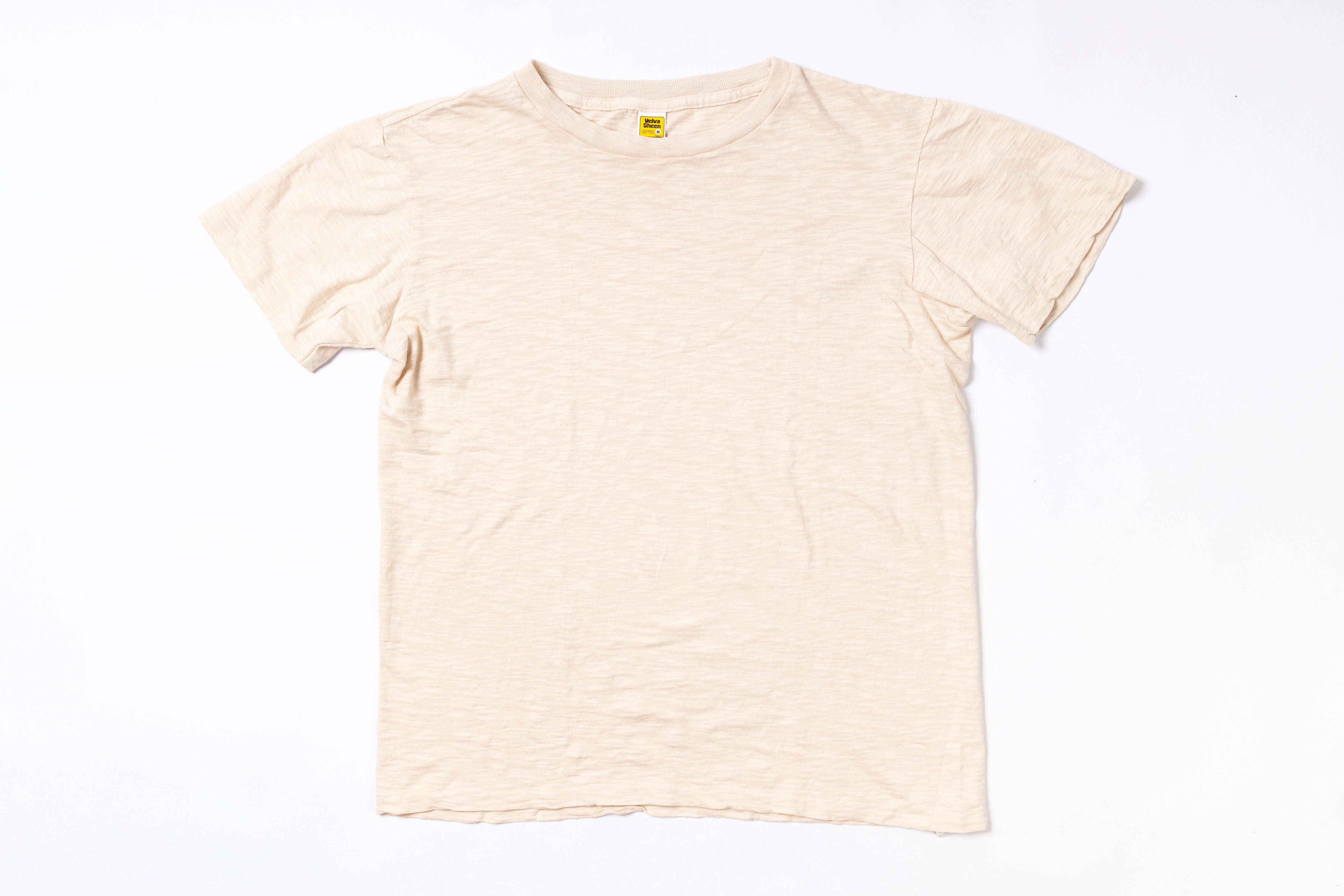 Beige t-shirt on a white background