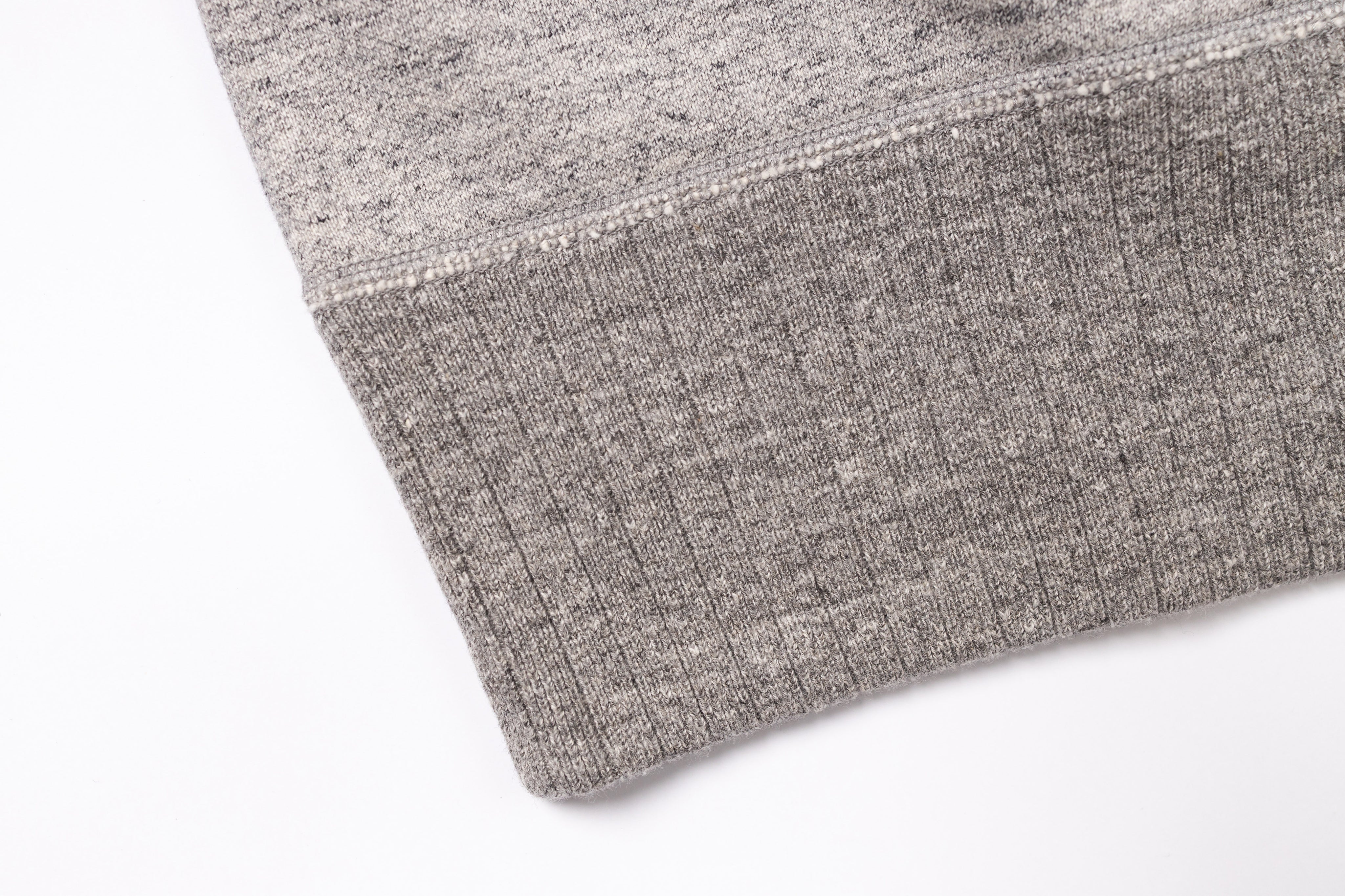 Close-up of a textured gray fabric on a white background